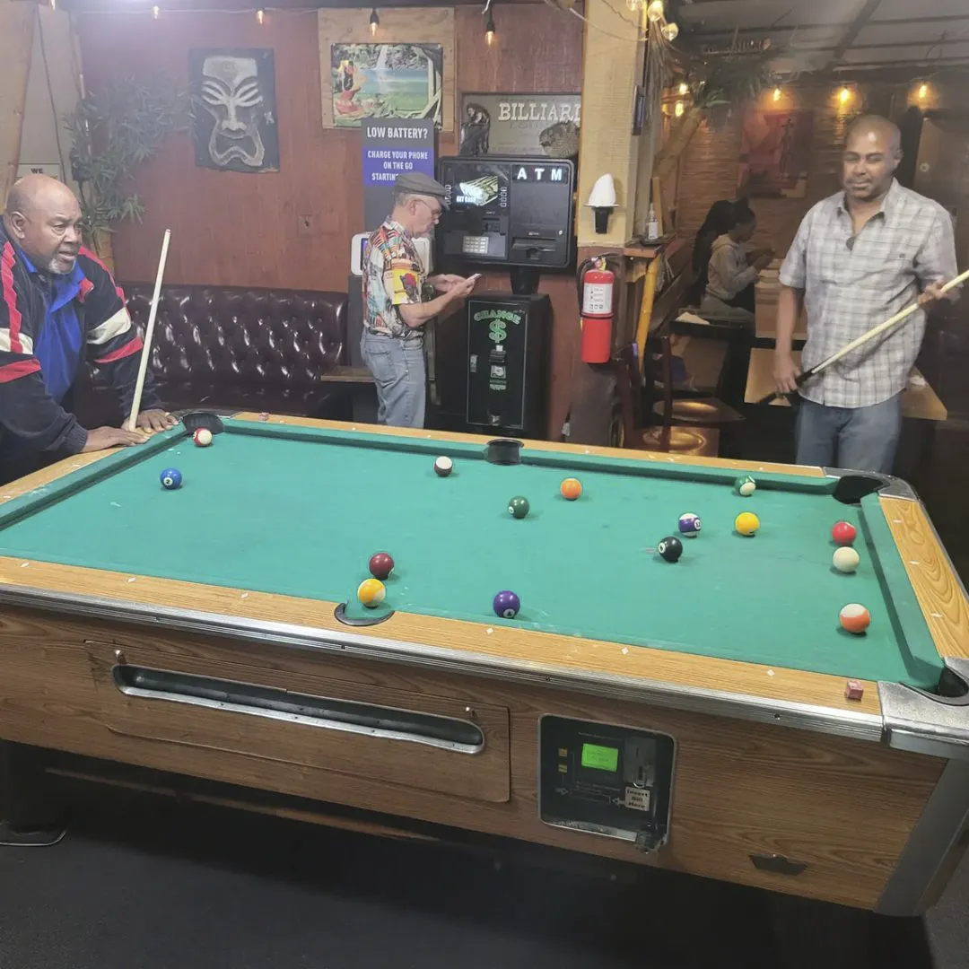 Bar guests playing pool near LAX airport
