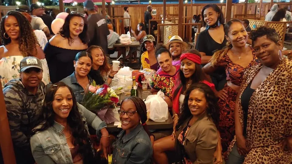Ladies group seated at outdoor patio party