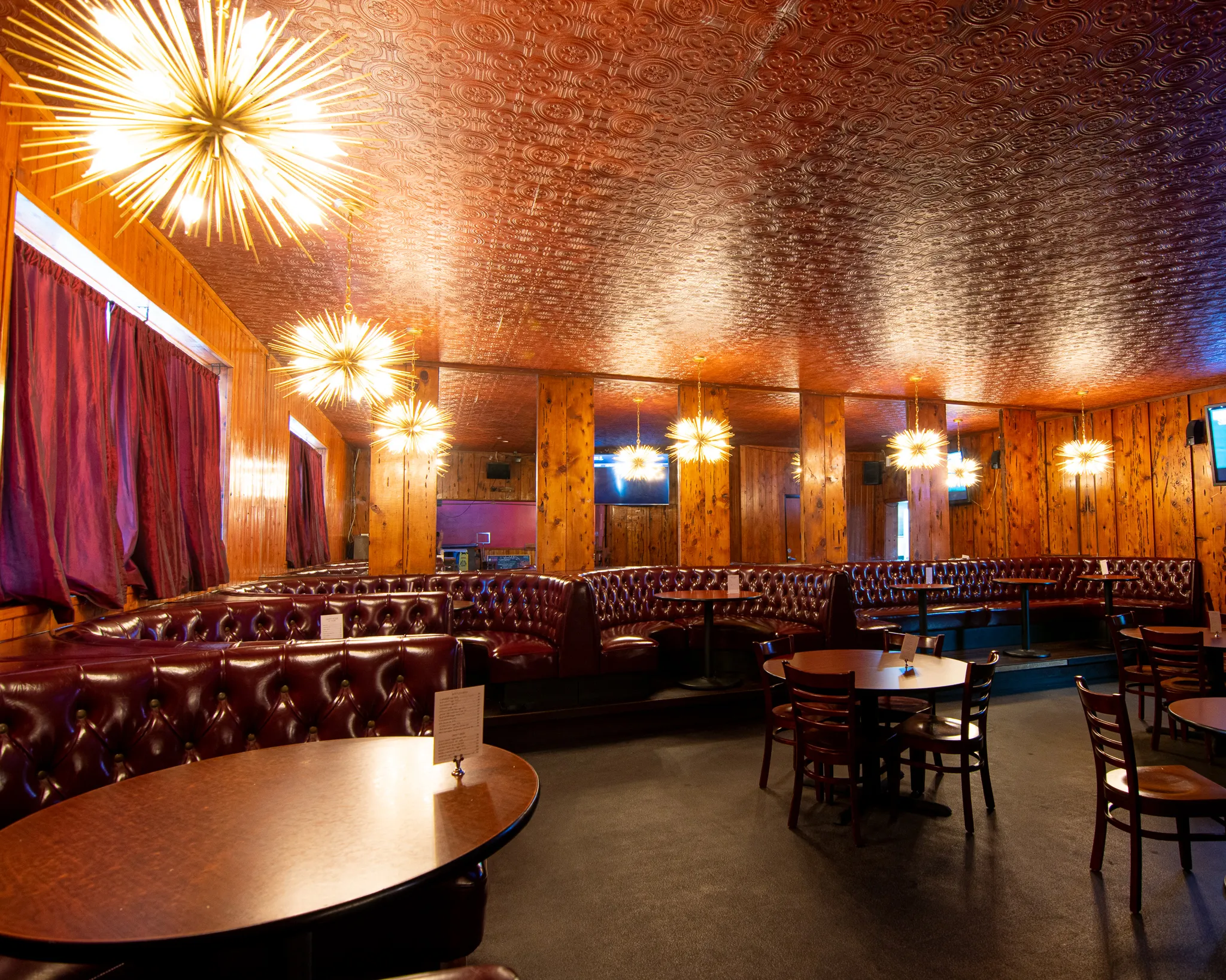 Midcentury modern private event booths with amber lights