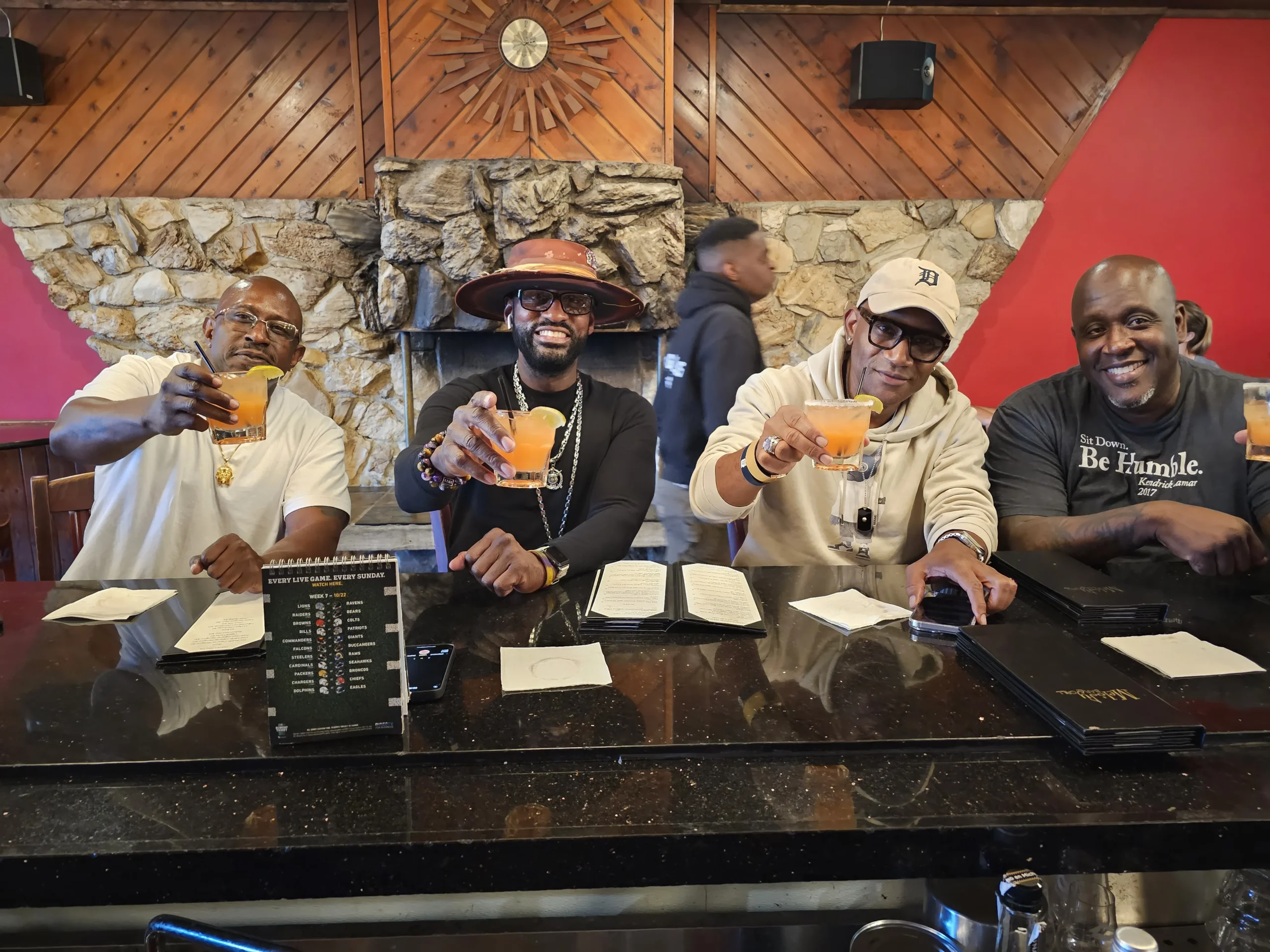 Group of men enjoying hip hop at Melody Bar