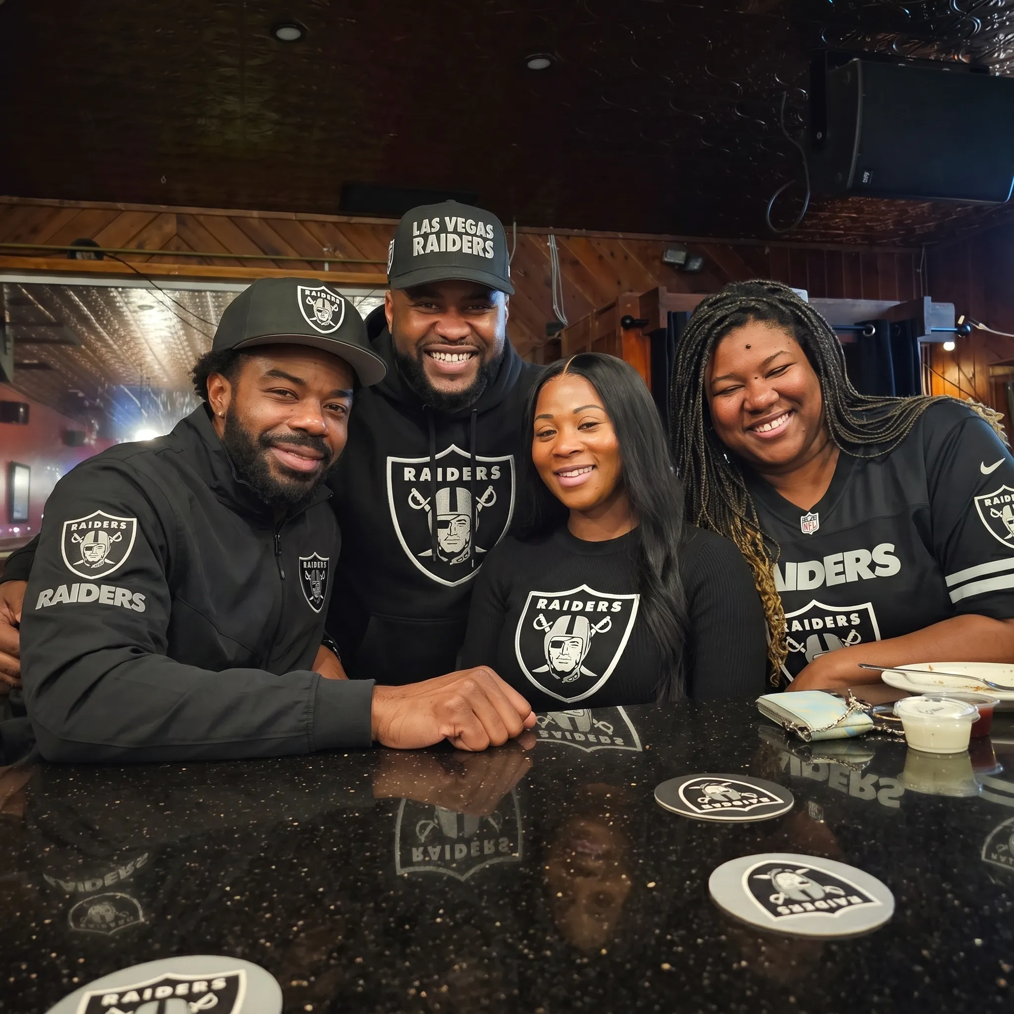 Raiders fans watching Raiders vs Dolphins at Melody Bar and Grill — Raiders bar near Inglewood